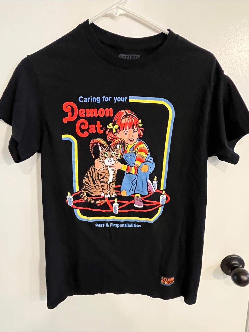 Women’s size small Steven Rhodes Caring For Your Demon Cat Tee Shirt